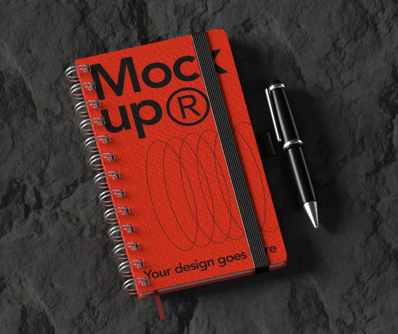3D Static Mockup Stationery Notebook With Pen On Rock Background